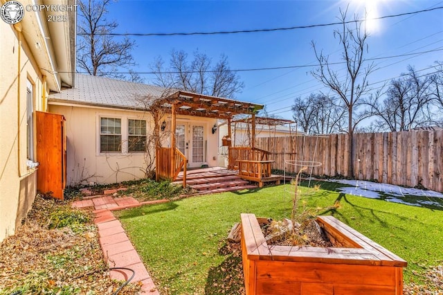 view of yard with french doors and a pergola