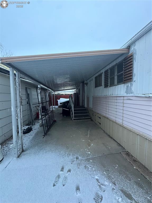 view of parking / parking lot with a carport