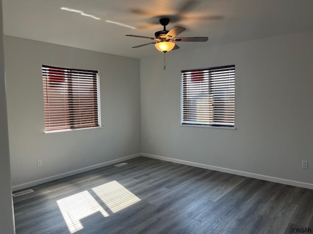 unfurnished room featuring ceiling fan and dark hardwood / wood-style floors