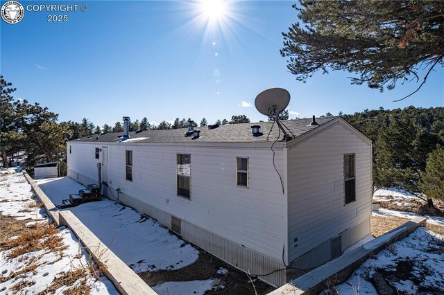 view of snow covered property