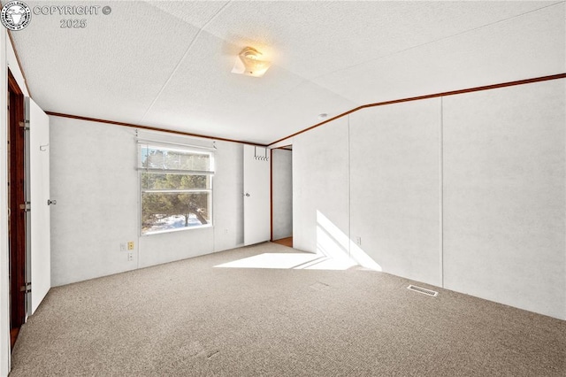 unfurnished bedroom with lofted ceiling and light colored carpet