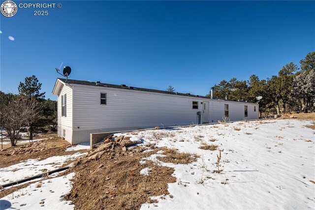 view of snow covered property