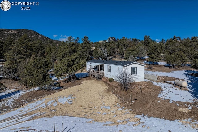 view of snow covered property