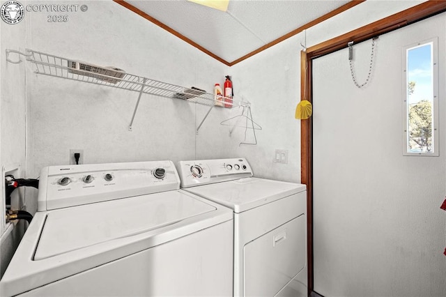 washroom featuring washer and clothes dryer