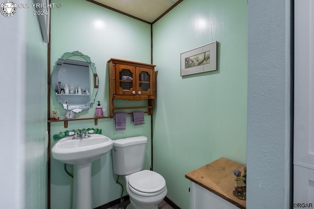 bathroom featuring sink and toilet