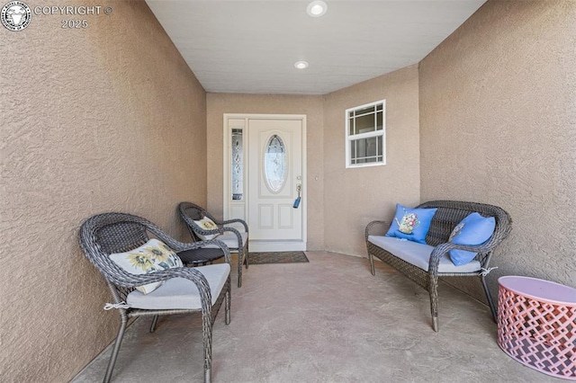 entrance to property featuring stucco siding