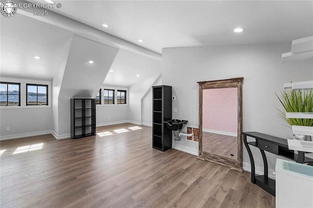 bonus room featuring lofted ceiling, light wood finished floors, recessed lighting, and baseboards