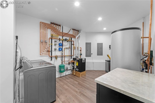 interior space featuring a heating unit, washing machine and clothes dryer, and electric panel