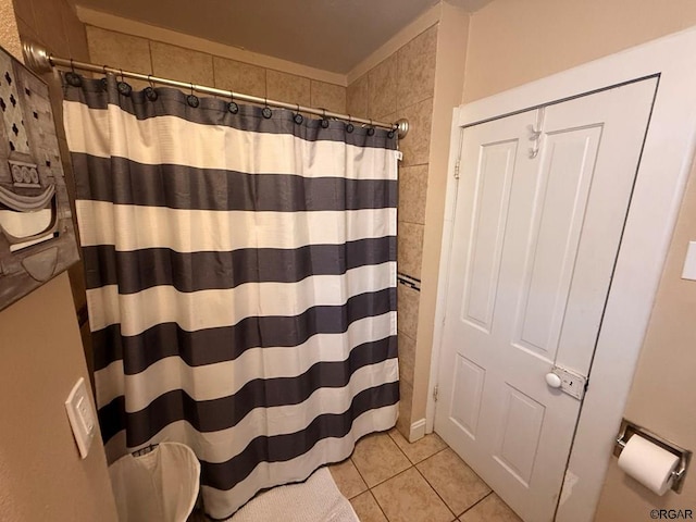 bathroom featuring tile patterned flooring and walk in shower