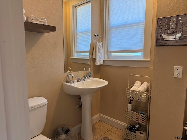 bathroom with sink, tile patterned floors, and toilet