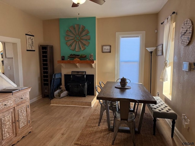 dining space featuring light hardwood / wood-style flooring and ceiling fan