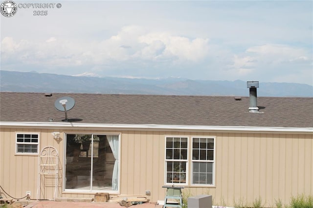 8 Cedar Ridge Rd, Williamsburg, CO 81226 - rear view of house featuring a mountain view and roof with shingles