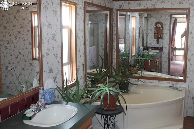 8 Cedar Ridge Rd, Williamsburg, CO 81226 - full bathroom with wallpapered walls, a bath, and vanity