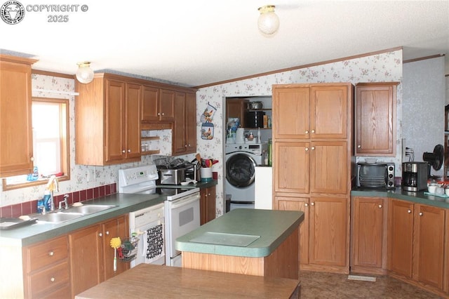 8 Cedar Ridge Rd, Williamsburg, CO 81226 - kitchen with wallpapered walls, electric range, crown molding, washer / dryer, and a sink