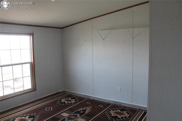 8 Cedar Ridge Rd, Williamsburg, CO 81226 - spare room with crown molding and a textured ceiling