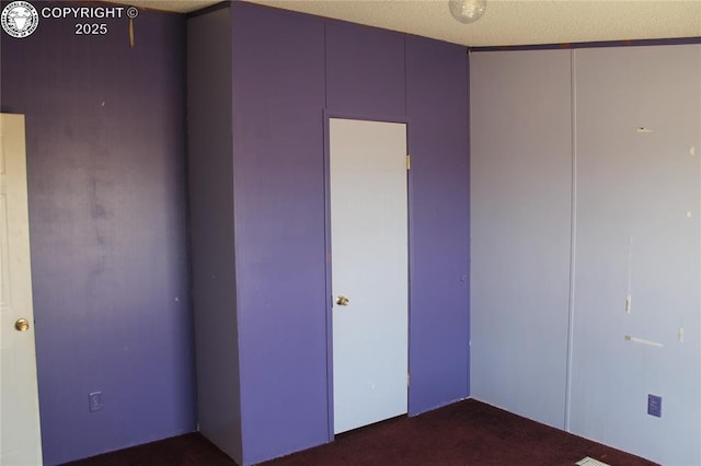 8 Cedar Ridge Rd, Williamsburg, CO 81226 - unfurnished bedroom with dark colored carpet and a closet