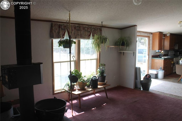 8 Cedar Ridge Rd, Williamsburg, CO 81226 - dining room featuring healthy amount of natural light, carpet, a textured ceiling, and crown molding