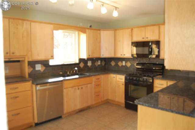 1207 Eugene Dr, Canon City, CO 81212 - kitchen with light brown cabinetry, black appliances, tasteful backsplash, a sink, and dark stone countertops