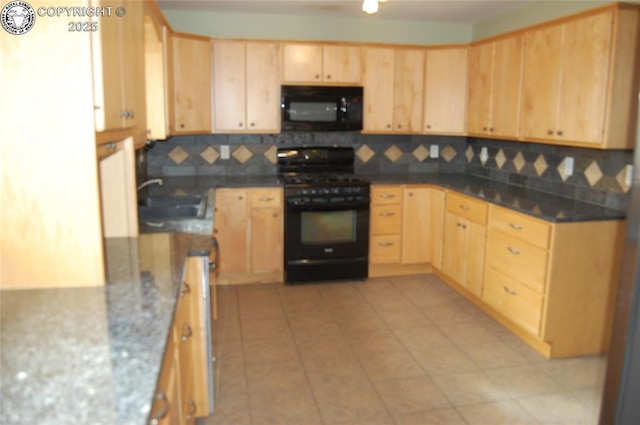 1207 Eugene Dr, Canon City, CO 81212 - kitchen featuring black appliances, light brown cabinetry, tasteful backsplash, a sink, and dark stone countertops