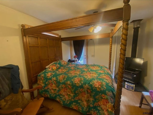 bedroom with ceiling fan and wood-type flooring