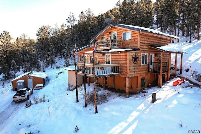 view of snow covered house