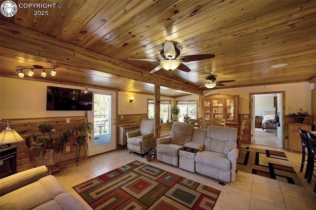 living room featuring wooden ceiling, plenty of natural light, and light tile patterned floors