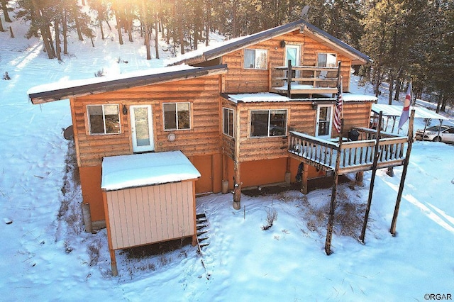 view of snow covered house