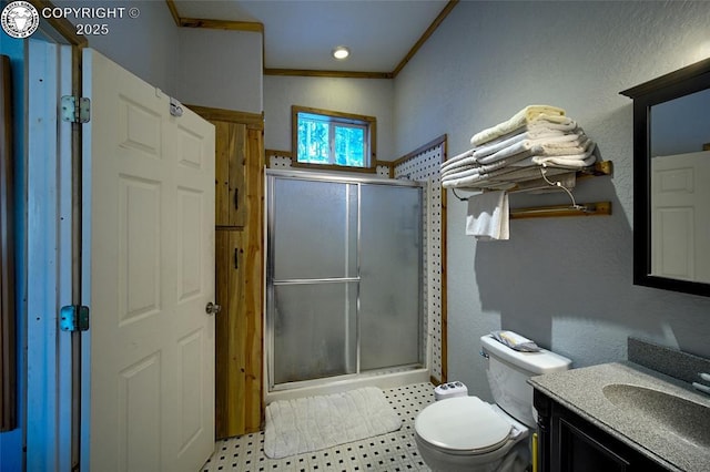 bathroom featuring toilet, a shower with shower door, crown molding, vaulted ceiling, and vanity