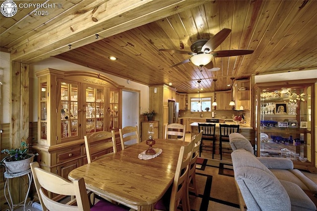 carpeted living room featuring wood ceiling, ceiling fan, and wood walls