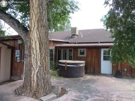 515 Mystic Ave, Canon City, CO 81212 - rear view of property with a hot tub, roof with shingles, and a patio