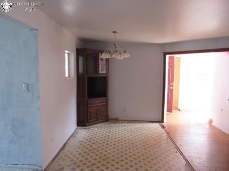 515 Mystic Ave, Canon City, CO 81212 - hallway featuring a chandelier