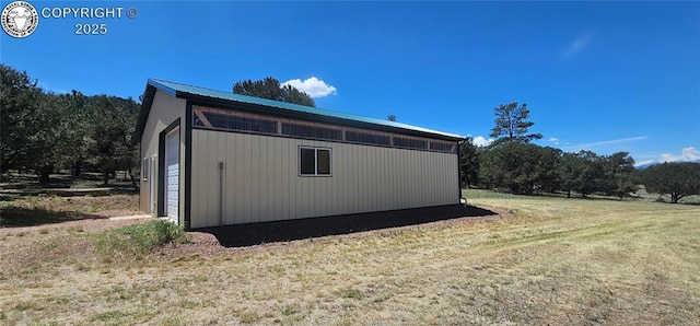 104 Sleepy Hollow Trl, Cotopaxi, CO 81223 - view of side of home with an outdoor structure, a yard, and a metal roof