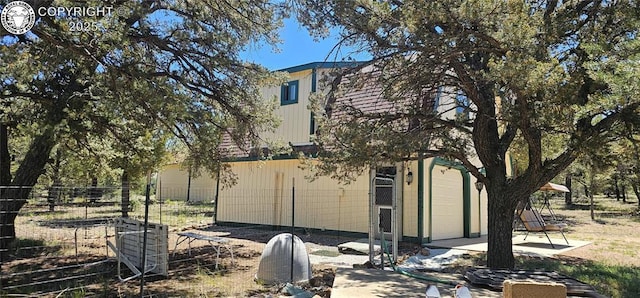 104 Sleepy Hollow Trl, Cotopaxi, CO 81223 - rear view of property with an attached garage