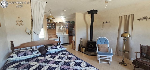 104 Sleepy Hollow Trl, Cotopaxi, CO 81223 - bedroom featuring a wood stove and wood finished floors