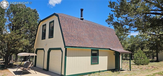 104 Sleepy Hollow Trl, Cotopaxi, CO 81223 - view of side of property with roof with shingles, a gambrel roof, and a garage