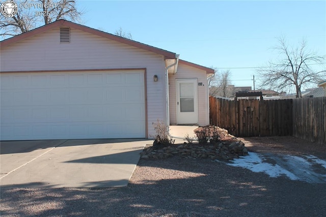 view of front of home with a garage and an outdoor structure