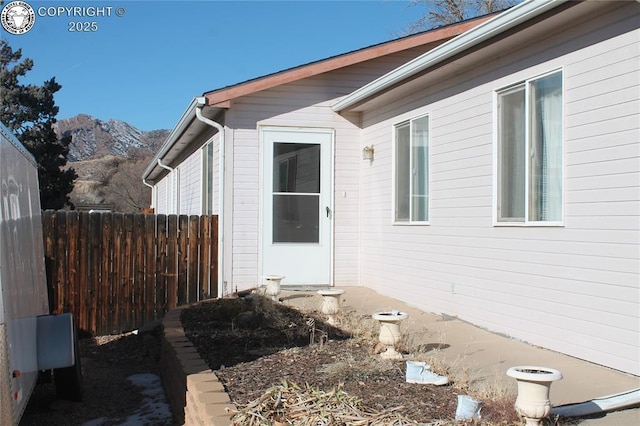 view of exterior entry with a mountain view