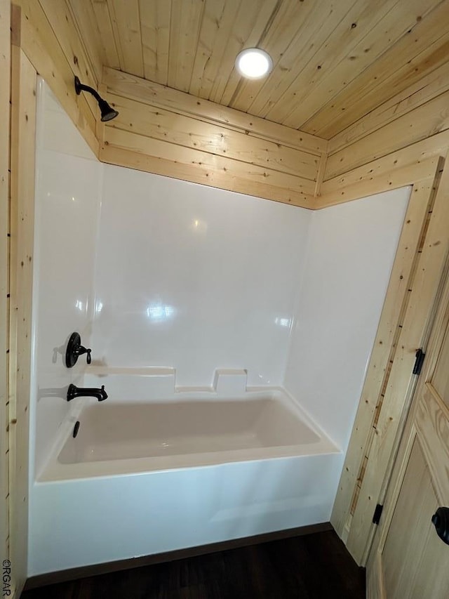 bathroom featuring washtub / shower combination and wooden ceiling