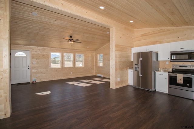 kitchen featuring vaulted ceiling, wooden ceiling, white cabinets, and appliances with stainless steel finishes