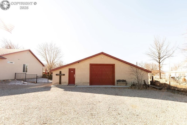 exterior space featuring fence and stucco siding