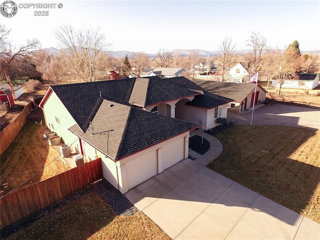 drone / aerial view with a residential view and a mountain view