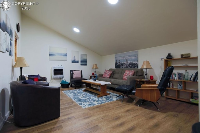 living area featuring high vaulted ceiling, recessed lighting, wood finished floors, and heating unit