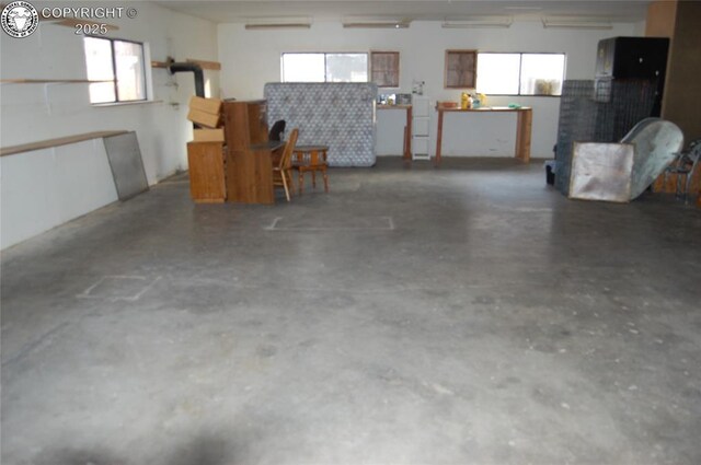 garage with a wall mounted air conditioner