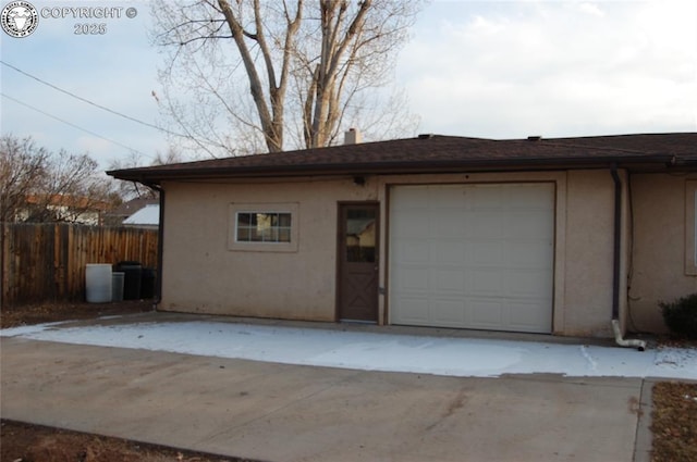 garage featuring fence