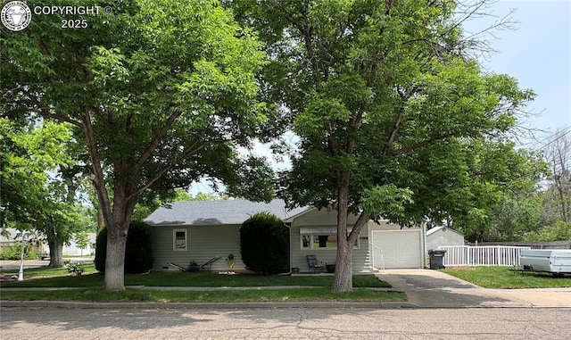 1230 N 6th St, Canon City, CO 81212 - view of front of property with concrete driveway and a garage