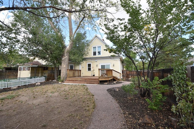 back of property with a wooden deck