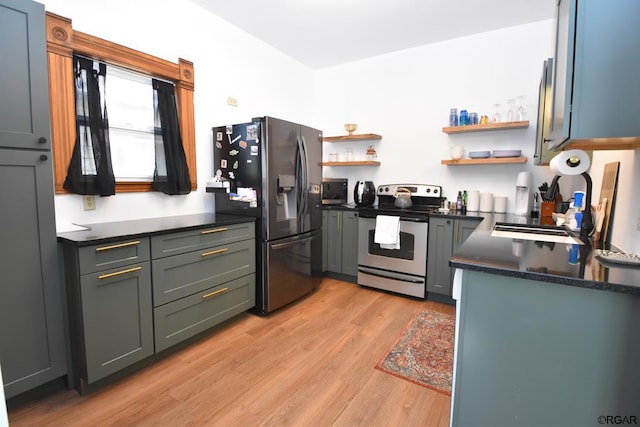 kitchen featuring appliances with stainless steel finishes and light hardwood / wood-style floors