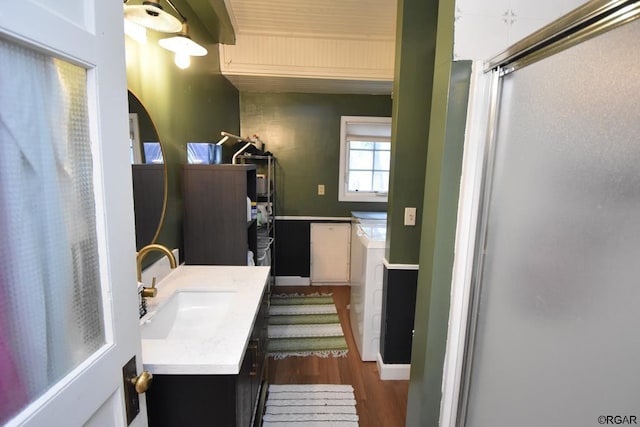 bathroom featuring sink and hardwood / wood-style floors