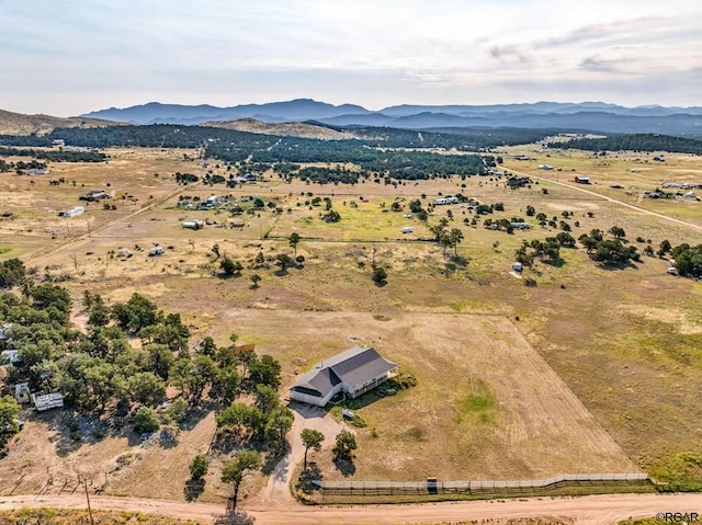 drone / aerial view featuring a rural view and a mountain view