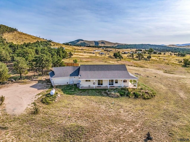 bird's eye view featuring a mountain view and a rural view